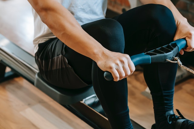 man on rowing machine fitness equipment involved in IP litigation